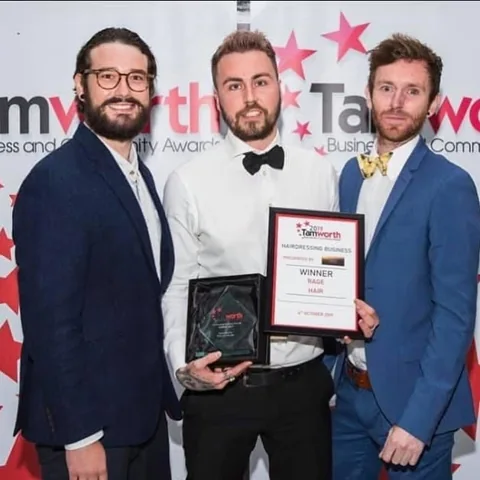RAGE holding the 2019 Tamworth Hairdressing Business winner’s certificate